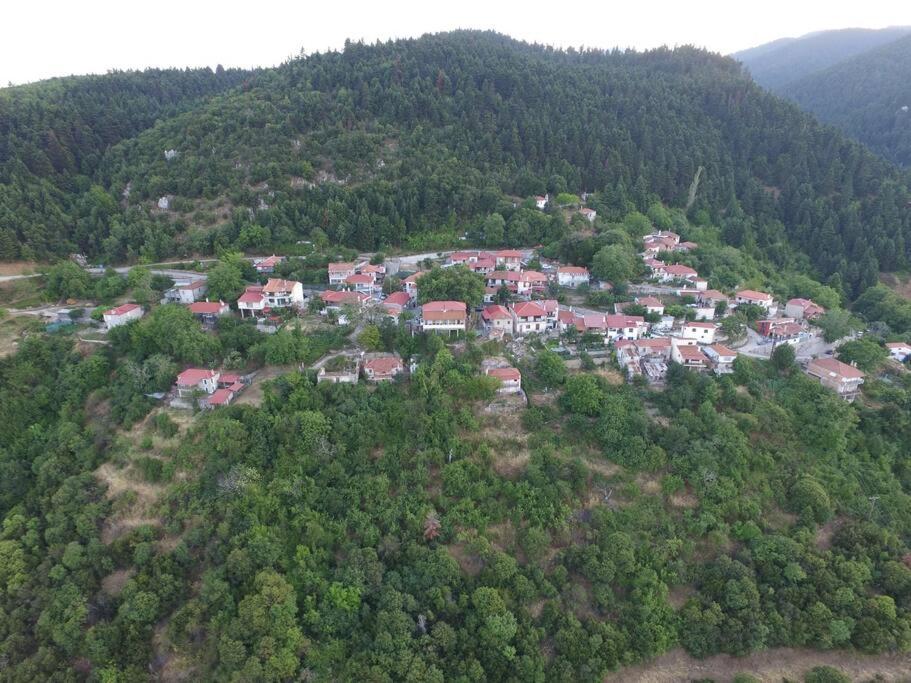 an aerial view of a town in the middle of a mountain at Shepherd's Cottage Koumaritsi 