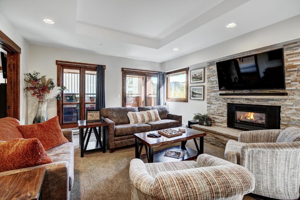 a living room with couches and a fireplace at Cozy and Luxe Ski In Ski Out Condo in Breckenridge condo in Breckenridge