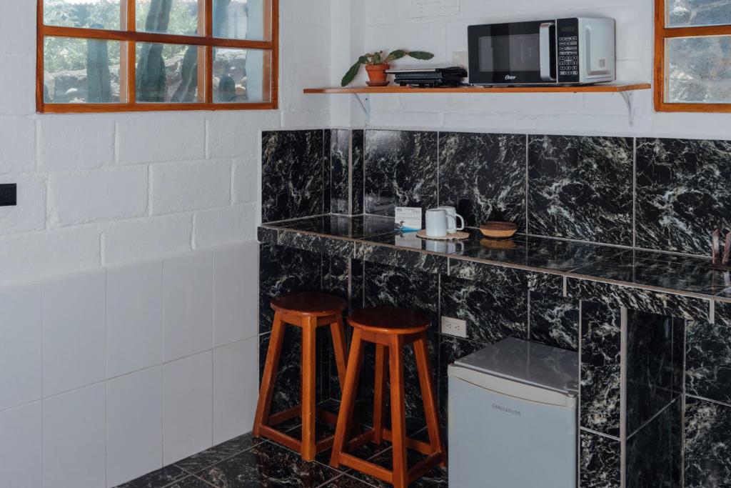 Kuchyň nebo kuchyňský kout v ubytování Hotel Pimampiro