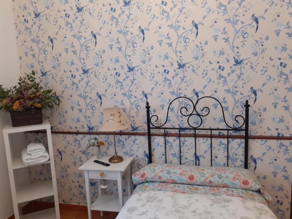 Postel nebo postele na pokoji v ubytování Uría 25 rooms