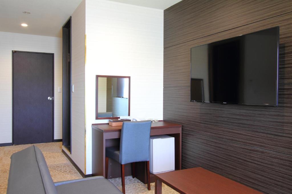 TV a/nebo společenská místnost v ubytování Hotel New Century