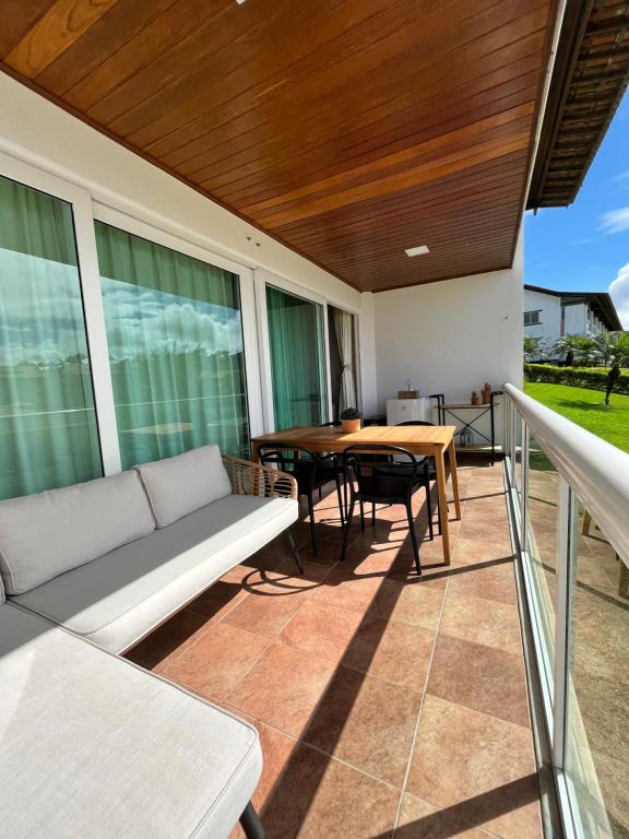 a living room with a couch and a table at Flat 707 Villa Hípica Gravatá PE in Gravatá