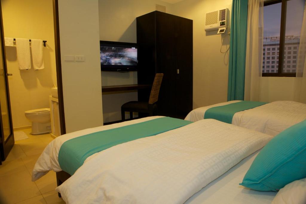 Postel nebo postele na pokoji v ubytování Alba Uno Hotel