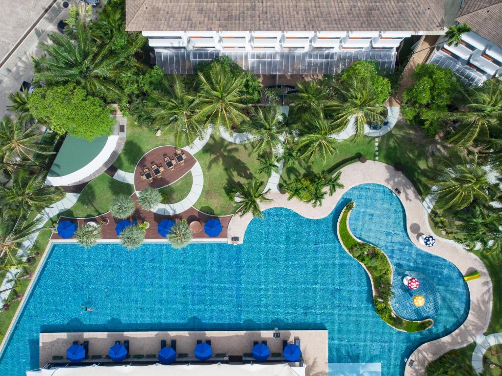 an overhead view of the pool at the resort at NH Boat Lagoon Phuket Resort in Phuket