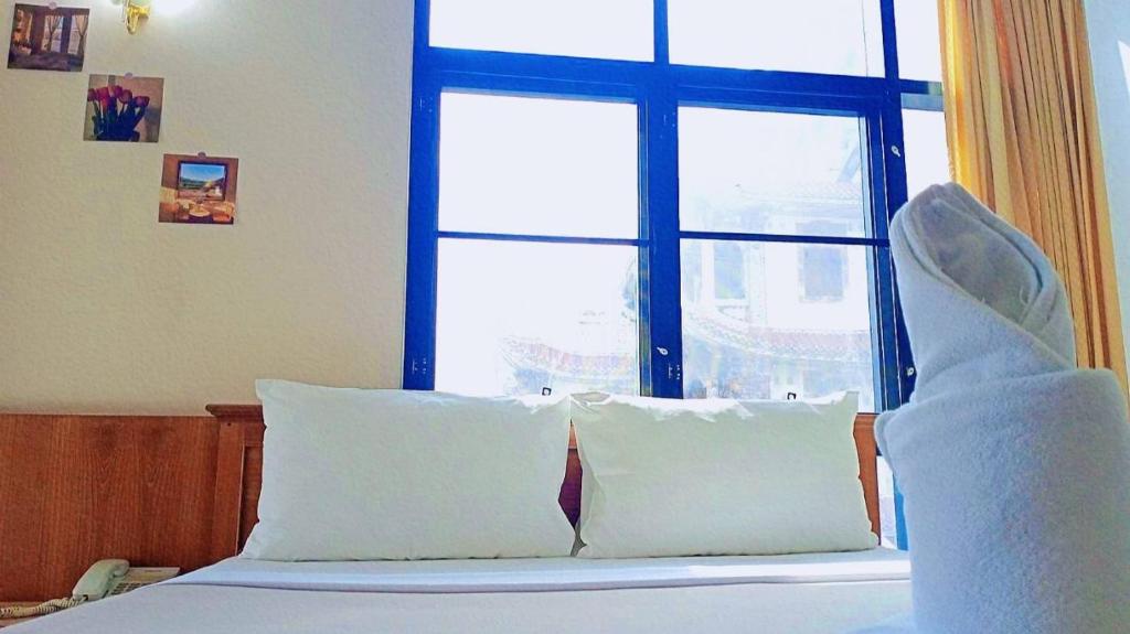 Ένα ή περισσότερα κρεβάτια σε δωμάτιο στο Wantana Mansion Check in before 8 pm