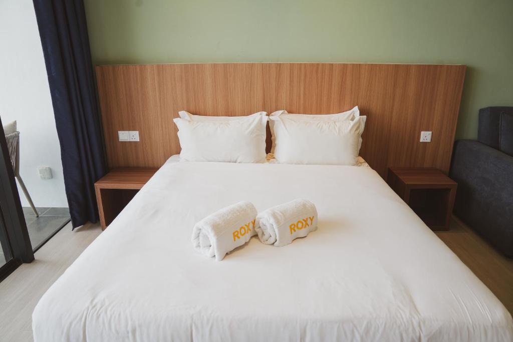 Postel nebo postele na pokoji v ubytování Roxy Beach Apartment