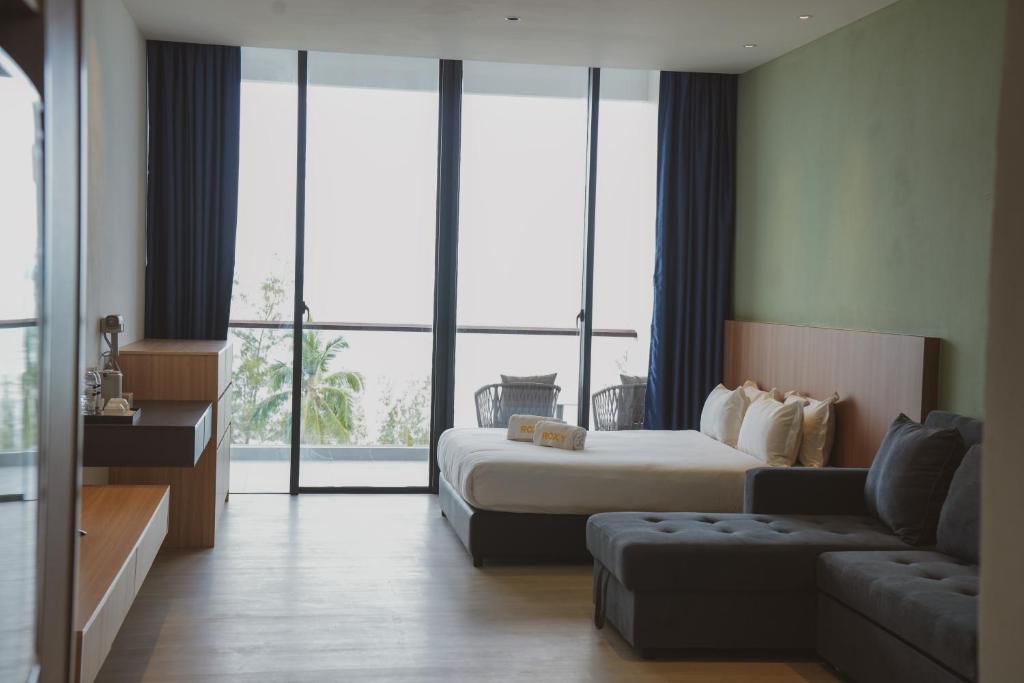 Postel nebo postele na pokoji v ubytování Roxy Beach Apartment