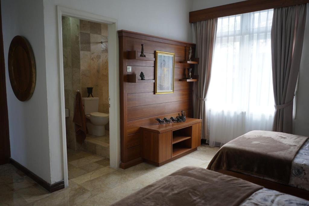 Letto o letti in una camera di Guildwood Villa Bali