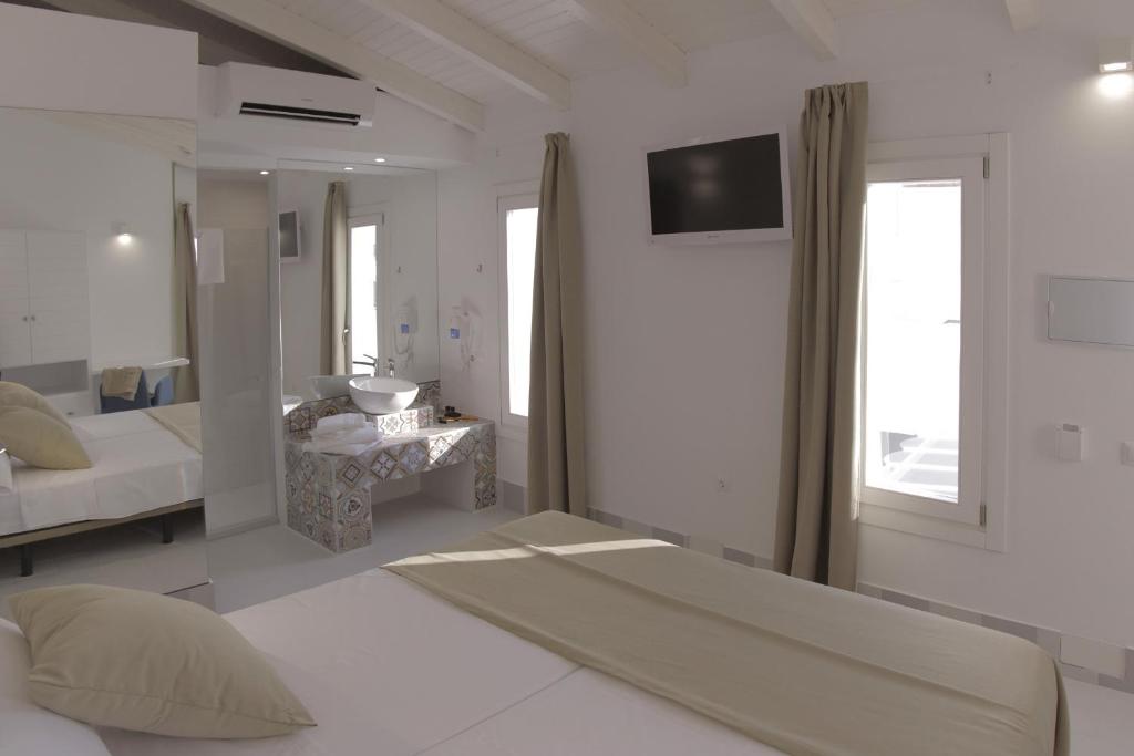Postel nebo postele na pokoji v ubytování Hostal Gravina