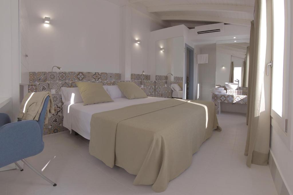 Postel nebo postele na pokoji v ubytování Hostal Gravina