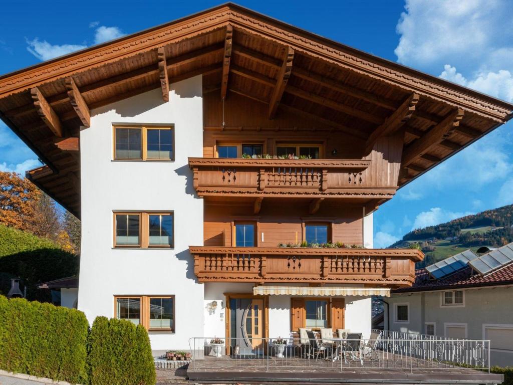 a house with a wooden roof at great apartment near the ski area in Hippach