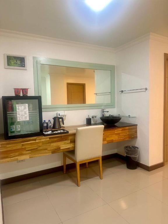 Kuchyň nebo kuchyňský kout v ubytování PUNTA CLARK HOTEL