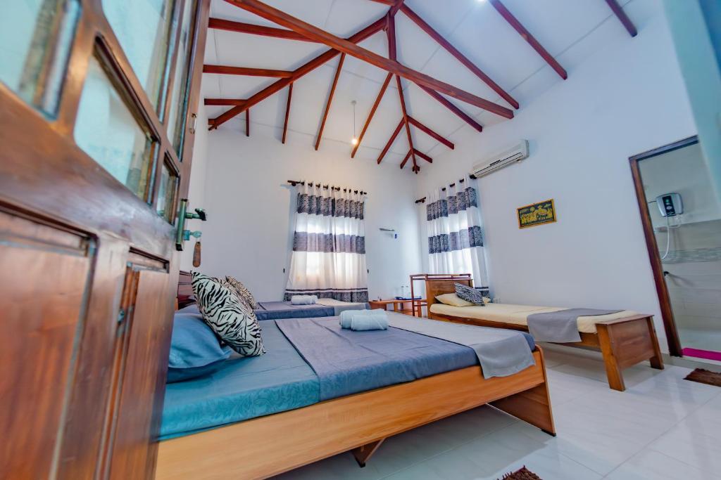 Postel nebo postele na pokoji v ubytování Ciel Grand Villa