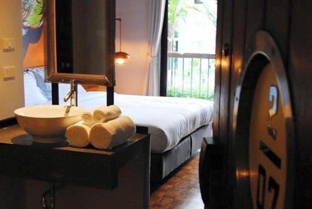 Postel nebo postele na pokoji v ubytování Cacha Hotel