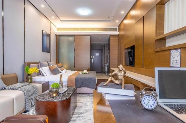 Ruang duduk di Millenia Executive Apartment Guangzhou East Railway Station Zhujiang New Town Branch - Free Shuttle Bus to Canton Fair Complex During Canton Fair Period