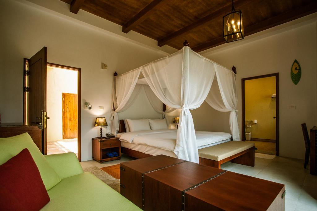 Postel nebo postele na pokoji v ubytování Oasis Hotel
