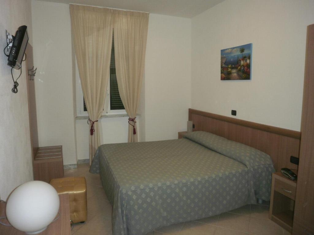Postel nebo postele na pokoji v ubytování Albergo Posta