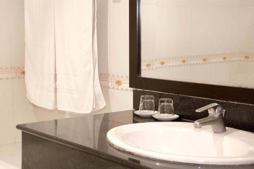 Koupelna v ubytování Angella Hotel