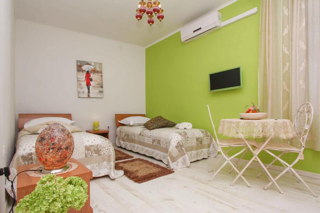 Televiisor ja/või meelelahutuskeskus majutusasutuses Apartment Jasmin