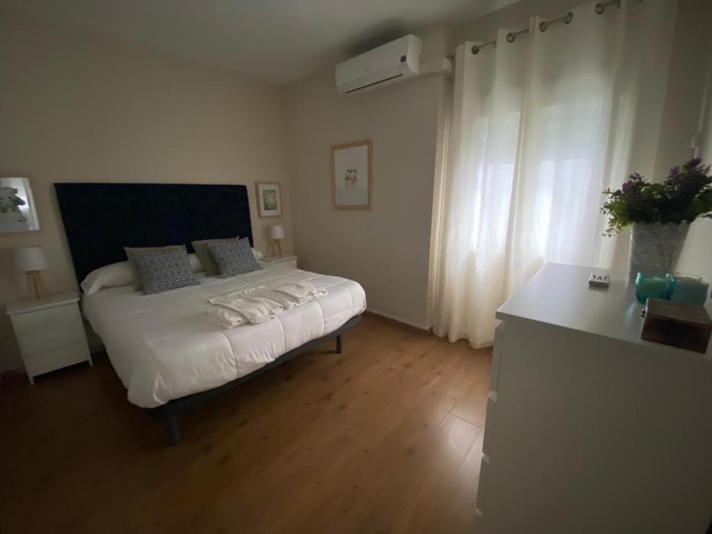 Postel nebo postele na pokoji v ubytování Apartamento Plaza Grande