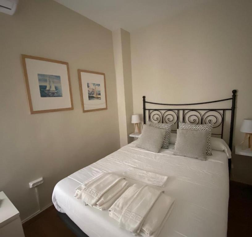 Postel nebo postele na pokoji v ubytování Apartamento Plaza Grande
