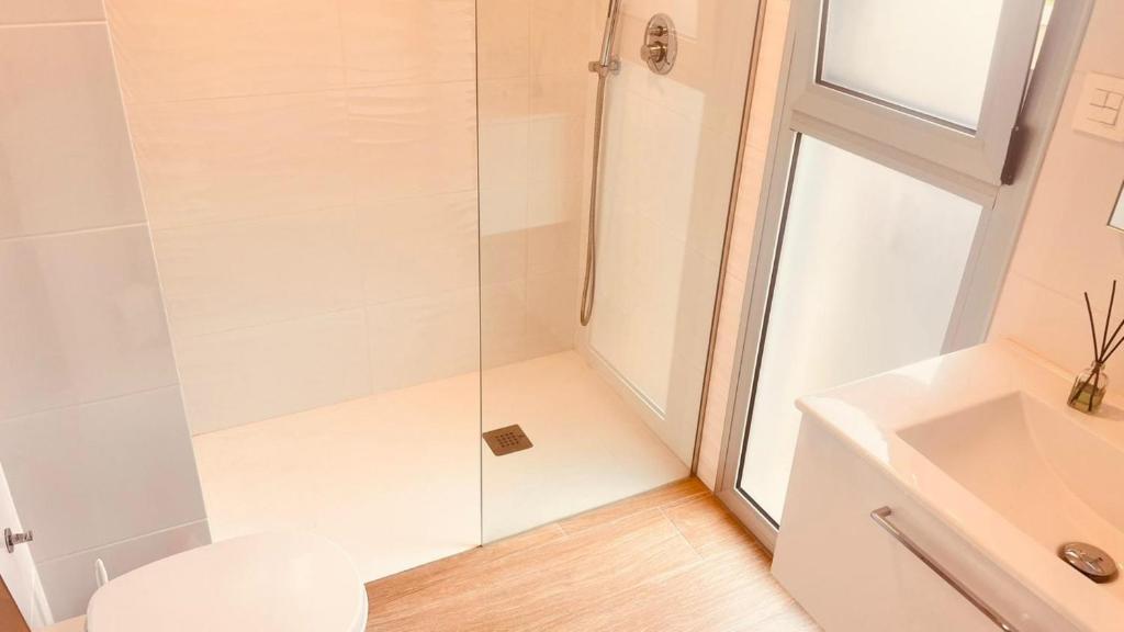 a bathroom with a shower with a toilet and a sink at Luxury Villa Torrevieja With Swimmingpool in Torrevieja