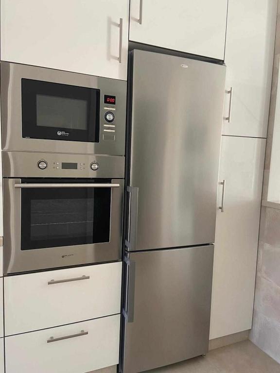 Kuchyň nebo kuchyňský kout v ubytování Duplex campoamor heated pool