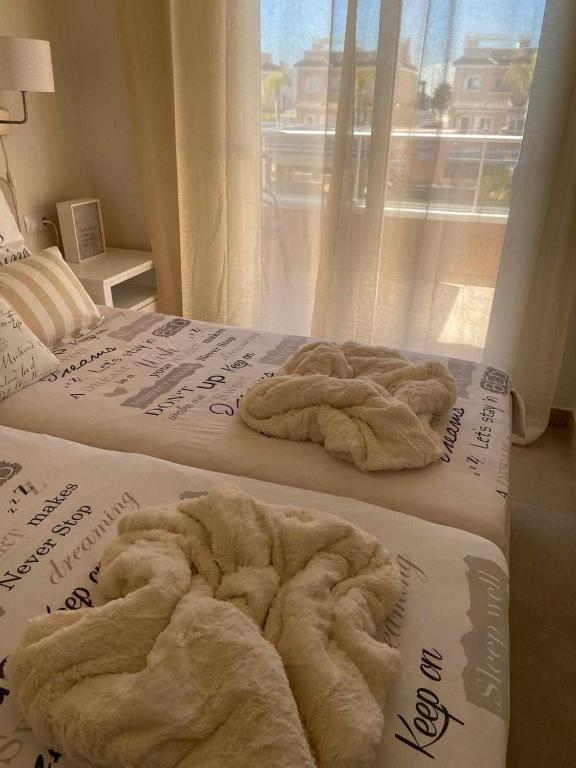 Postel nebo postele na pokoji v ubytování Duplex campoamor heated pool