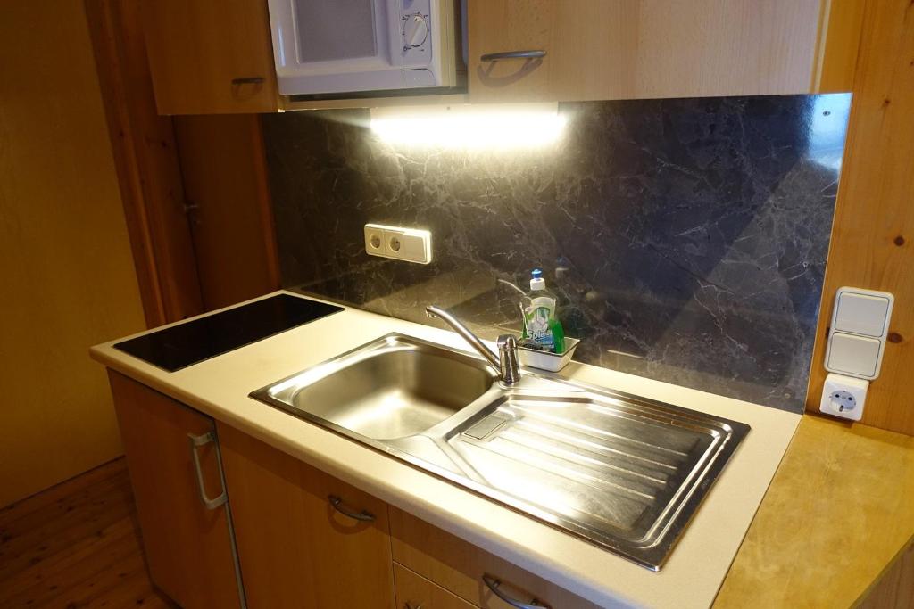 Kuchyň nebo kuchyňský kout v ubytování Apartmentshaus Dual -1
