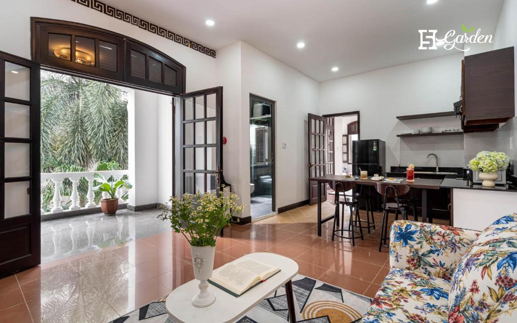 a living room with a couch and a table at 5H Garden in Ho Chi Minh City