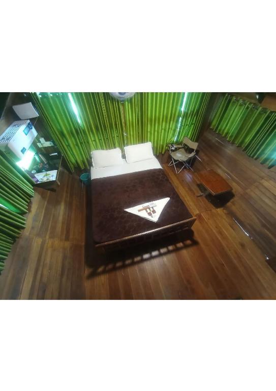 Postel nebo postele na pokoji v ubytování Tree House Wayanad