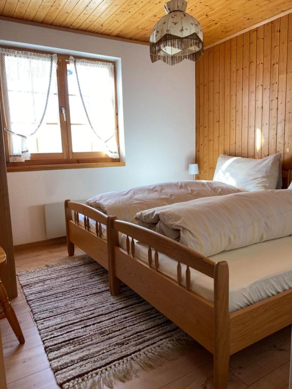 Postel nebo postele na pokoji v ubytování Chalet Bellwald
