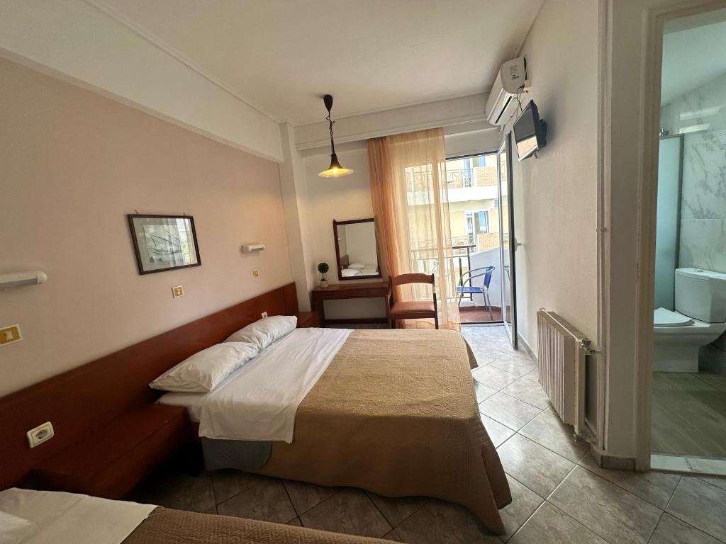 Postel nebo postele na pokoji v ubytování Captain's Hotel
