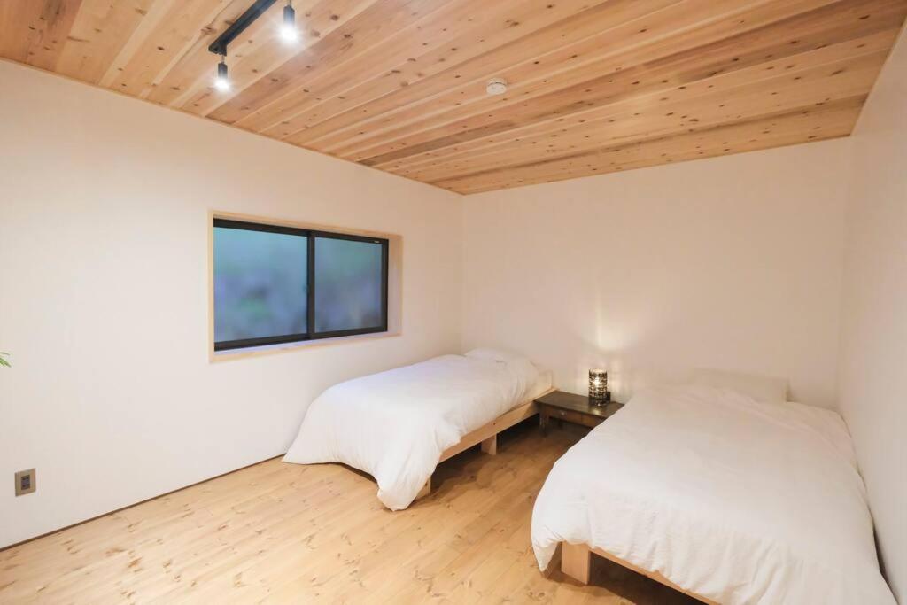 Postel nebo postele na pokoji v ubytování プラベート薪サウナ付 1日1組限定ease1高山村