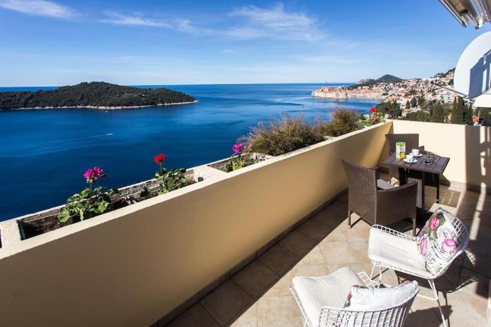 a balcony with a view of the ocean at Leo Apartment in Dubrovnik