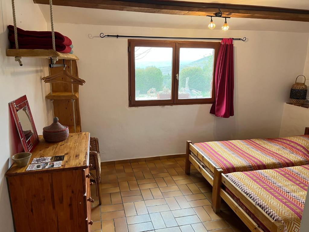 Postel nebo postele na pokoji v ubytování Chambres d'hôtes Gîte Saint Roch