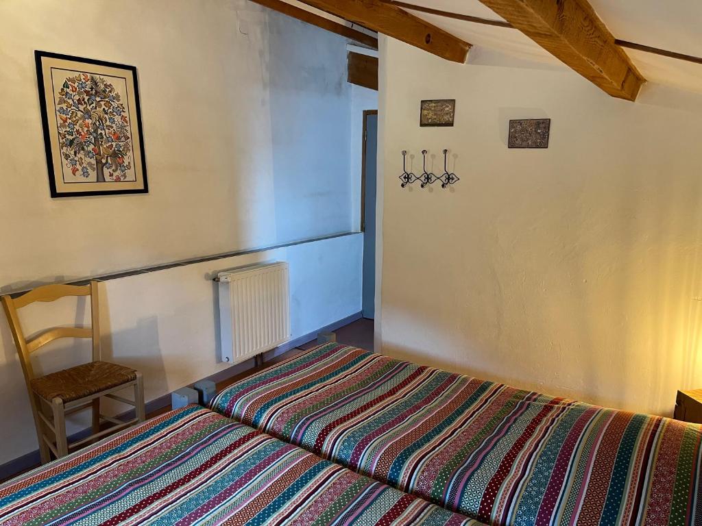 Postel nebo postele na pokoji v ubytování Chambres d'hôtes Gîte Saint Roch