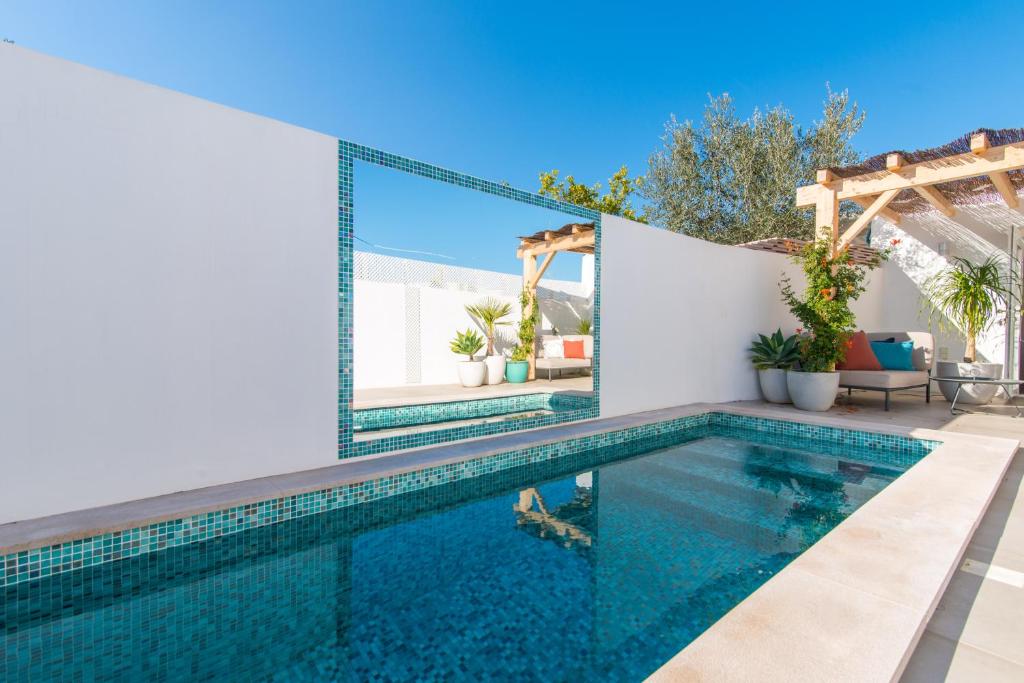 a swimming pool in a villa with a view at Rocco House By ALGARTUR in Tavira