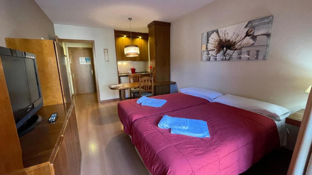Postel nebo postele na pokoji v ubytování Apartamentos Los Lagos