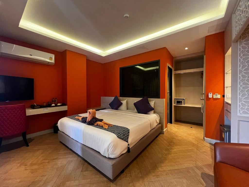 Postel nebo postele na pokoji v ubytování Le Maroc Hotel Patong