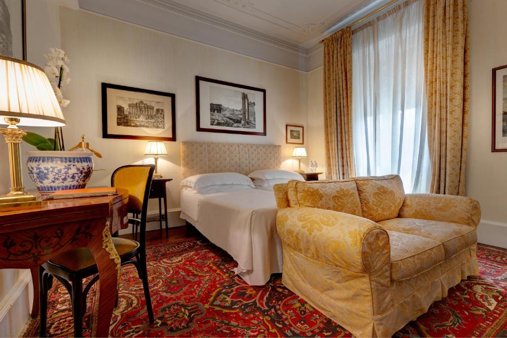 Postel nebo postele na pokoji v ubytování Grand Hotel Plaza