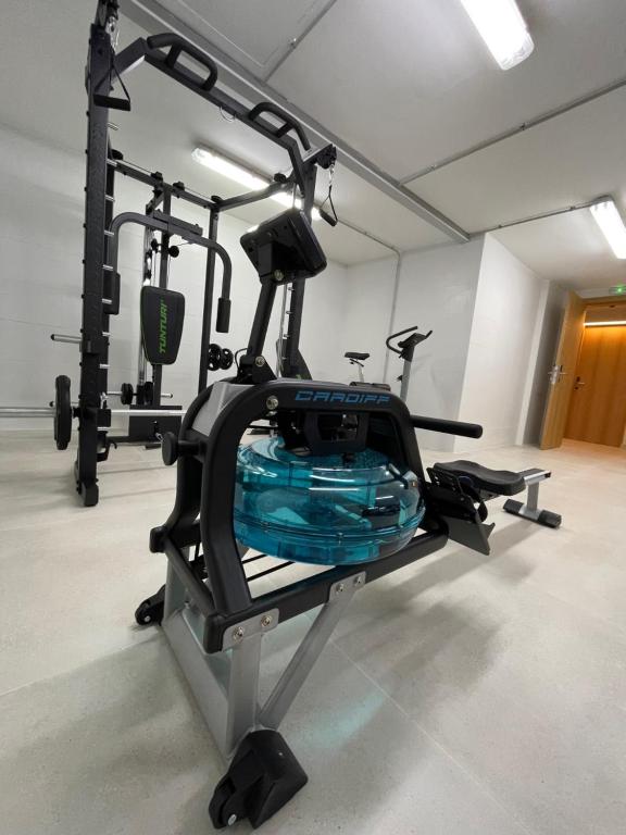 a gym with several tread machines in a room at Apartamentos Playa Victoria in Cádiz