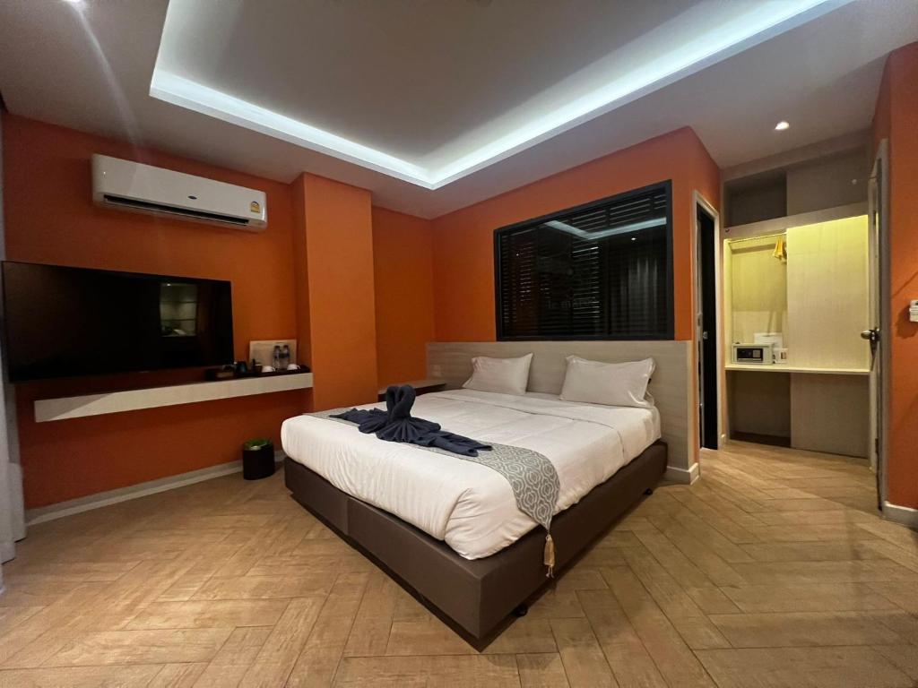Postel nebo postele na pokoji v ubytování Le Maroc Hotel Patong