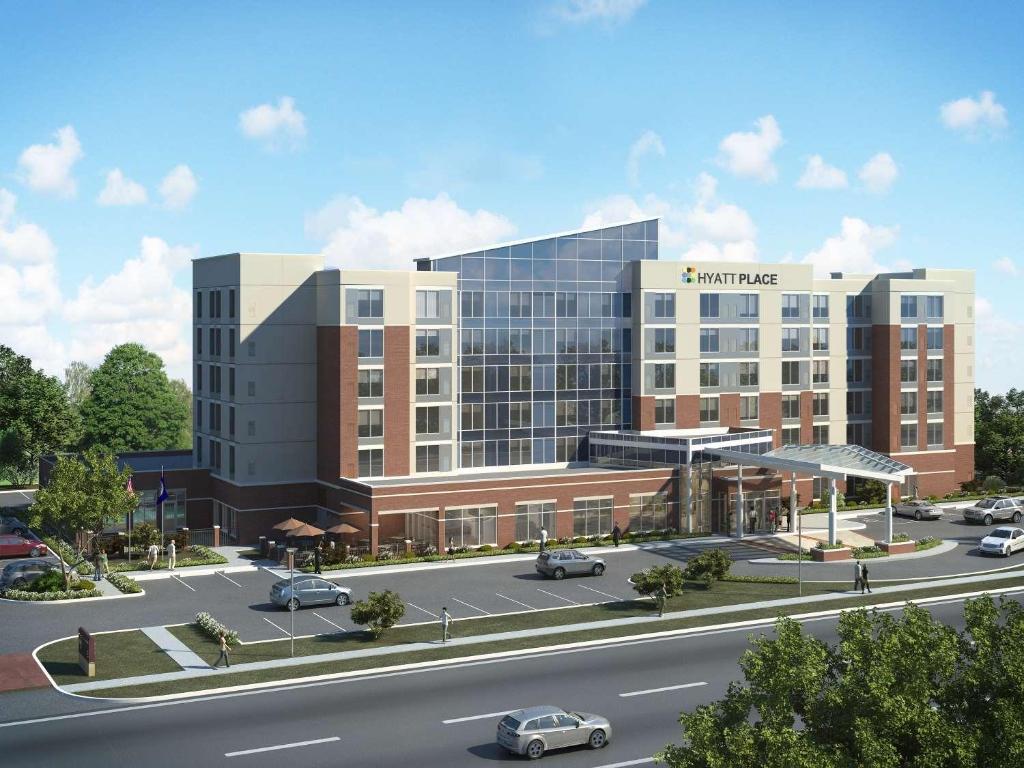 a rendering of a large building with a parking lot at Hyatt Place DFW in Irving