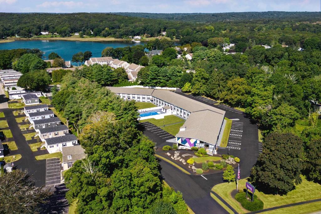 an aerial view of a resort with a lake at Spark By Hilton Mystic Groton in Mystic