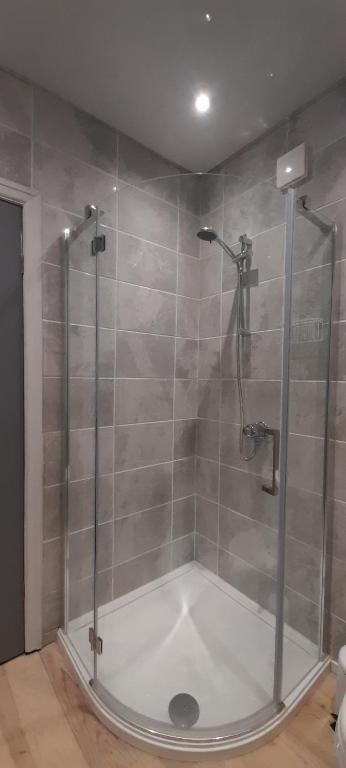 a shower with a glass door in a bathroom at Ribbleton Rendezvous in Preston in Preston