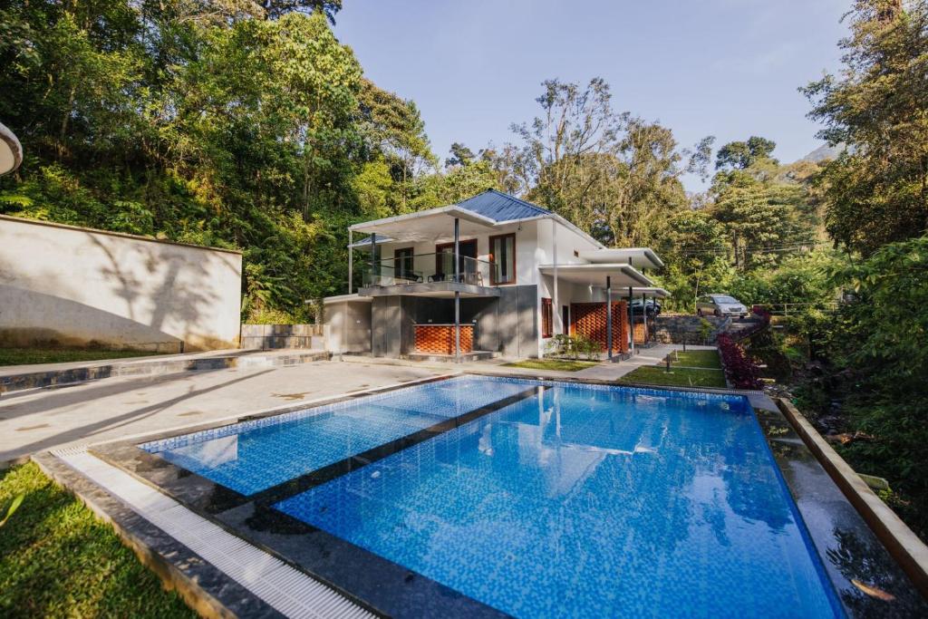 Bazén v ubytování Elixir Woods Luxury Resort And Spa, Munnar nebo v jeho okolí