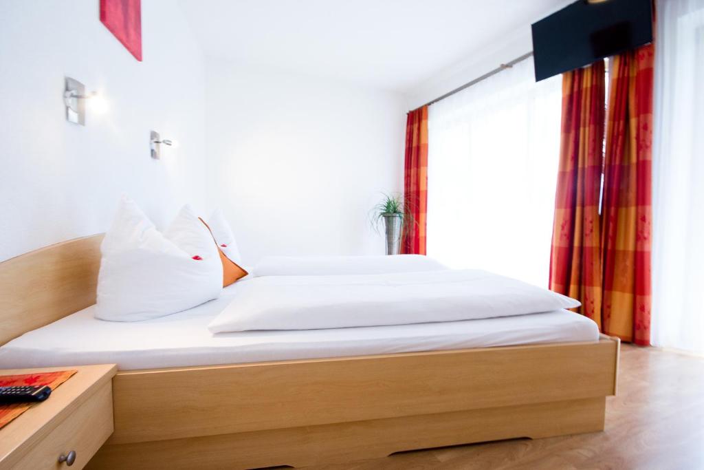A bed or beds in a room at Apart Bergecho