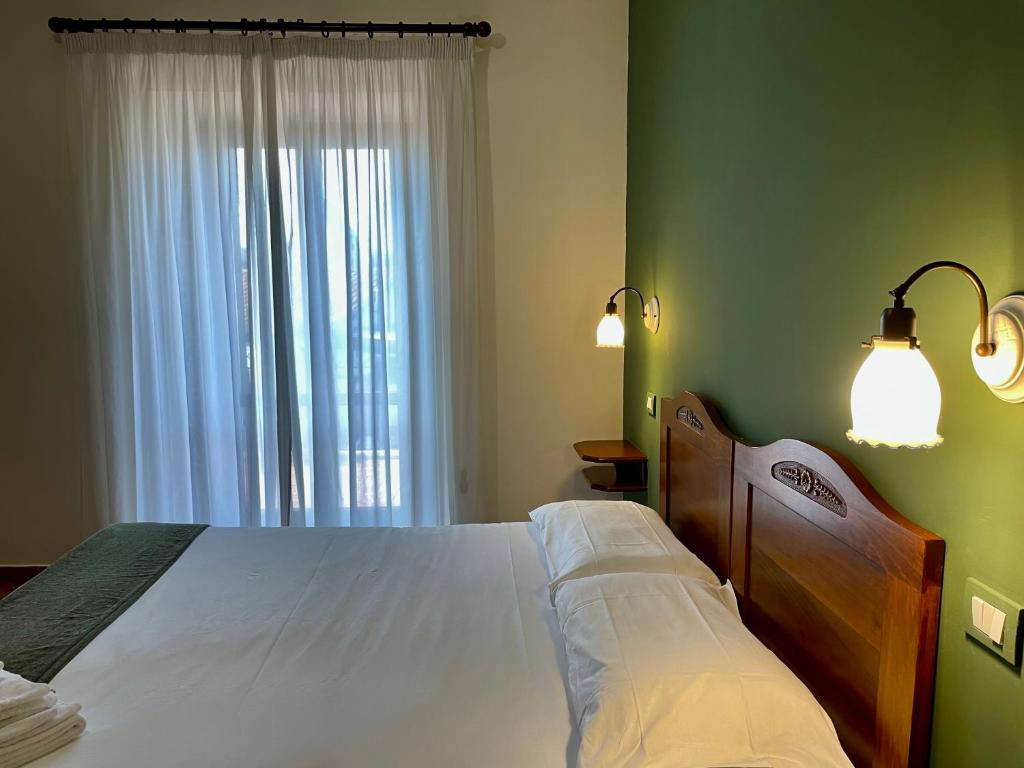 Postel nebo postele na pokoji v ubytování Mingone Hotel Ristorante