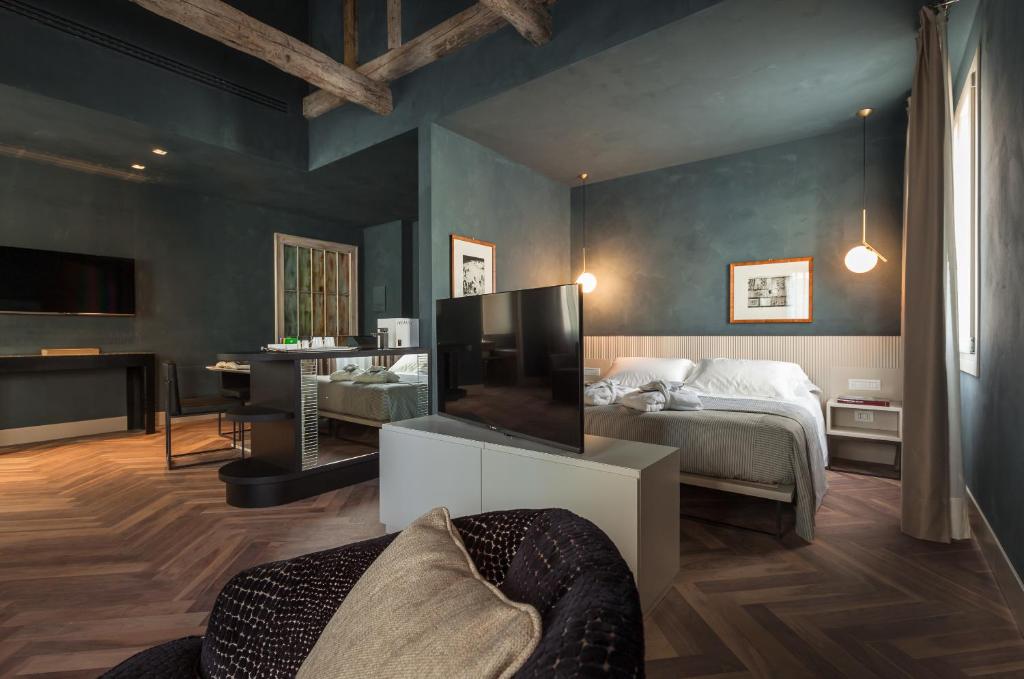 Postel nebo postele na pokoji v ubytování Liassidi Wellness Suites
